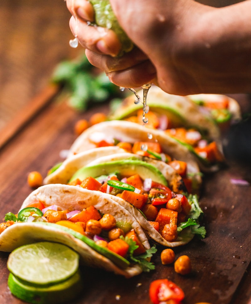 Colorful spread of traditional Mexican dishes on a wooden table